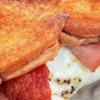 Bacon Egg & Cheese French Toast Sandwich · Two eggs, melted cheese, and bacon served between two slices of French toast.