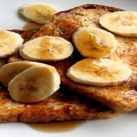 Classic French Toast · 4 Slices French Toast , Syrup, Butter | 
Four slices of  egg-washed French toast topped with...