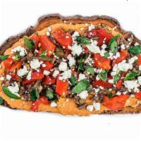 The G.O.A.T. Toast · Roasted red pepper hummus, olive tapenade, crumbled goat cheese, roasted red pepper, and bas...