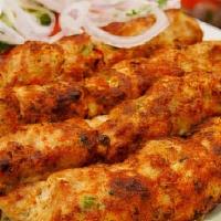 2 Chicken Seek Kebab Rice  · Minced meat mixed with onions, spices and fresh herbs, grilled on skewers.