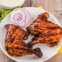 Tandoori Chicken(2)Pec Tikka With Bone And Basmati Rice · Marinated chicken leg slowly grilled to perfection.
