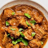 Karahi Gosht With  Basmati Rice · Pieces of goat cooked with fresh herbs and spices.
