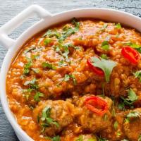 Goat Dal /Basmati Rice · Served with fresh herbs and spices.