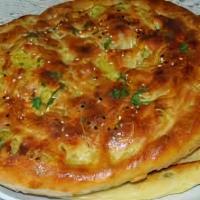 Aloo Paratha · Vegetarian. Soft white flour bread filled with a mix of potato, parsley and herbs pan fried.