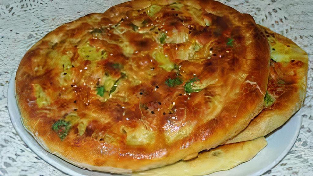Aloo Paratha · Vegetarian. Soft white flour bread filled with a mix of potato, parsley and herbs pan fried.