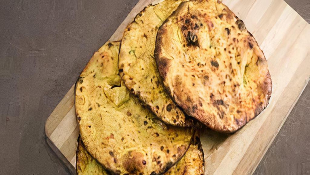 2,Missy Roti (Good For Diabetes)With Chana Masala · Traditional style Pakistani tandoori Roti,Gram flour & whole wheat flour,blending onion and herbs.