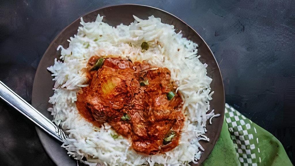 Chicken Achar And Basmati Rice · Boneless chicken cooked in curry sauce with pickle spices.
