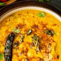 Dal Tadka · Vegetarian. Split lentils cooked with with ginger tempered with mustard seeds, onions and ga...
