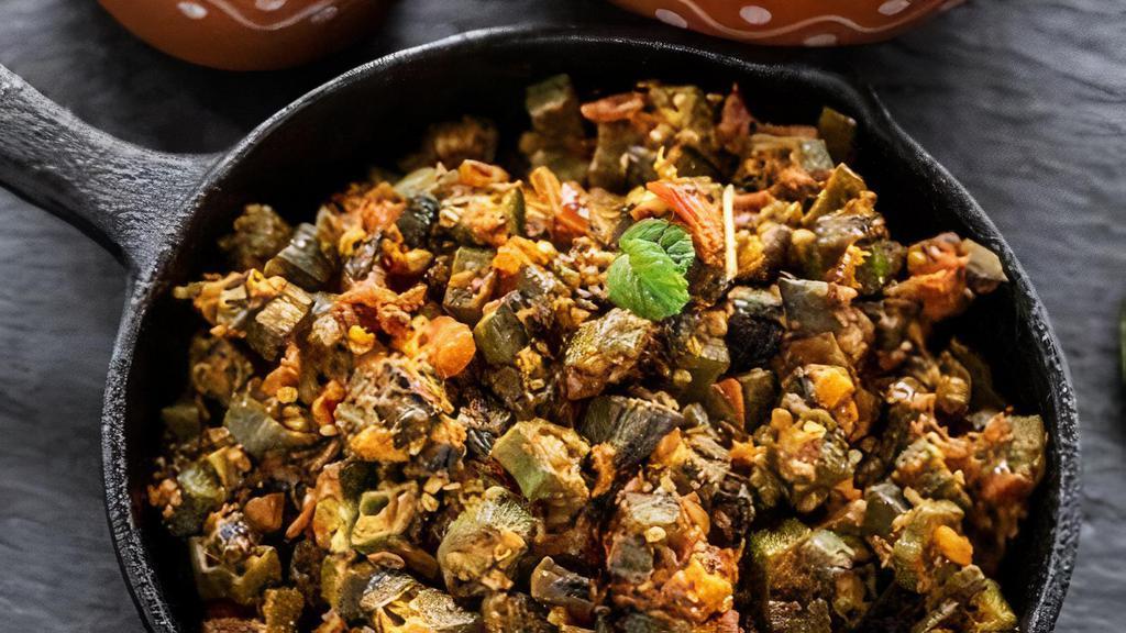Bhindi Masala · Vegetarian. Okra cooked with onion, tomato, herbs and spices.