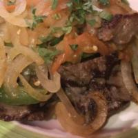 Bistec A La Mexicana / Mexican Style Beef Steak  · Bistec salteado con cebolla, jalapeños y tomates. / Steak sautéed with onions, jalapeños and...