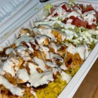 Halal Chicken Over Rice  · Marinated chicken over seasoned rice topped with white sauce. (Hot sauce optional, indicate ...