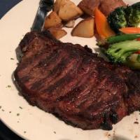 Ny Strip Steak · Charbroiled, served with roasted red potatoes or risotto and sautéed vegetables.