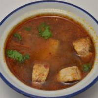 Tom Yum Goong · Spicy. Full serving only. Sweet and sour soup with shrimp, mushrooms, onions, lime leaf, lem...