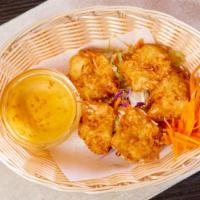 Coconut Shrimp (4 Pcs) · Crispy fried jumbo shrimp with coconut dipping sauce.