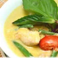 Green Curry · Green curry paste with coconut milk, eggplant, bell pepper, string bean, bamboo shoot, and t...