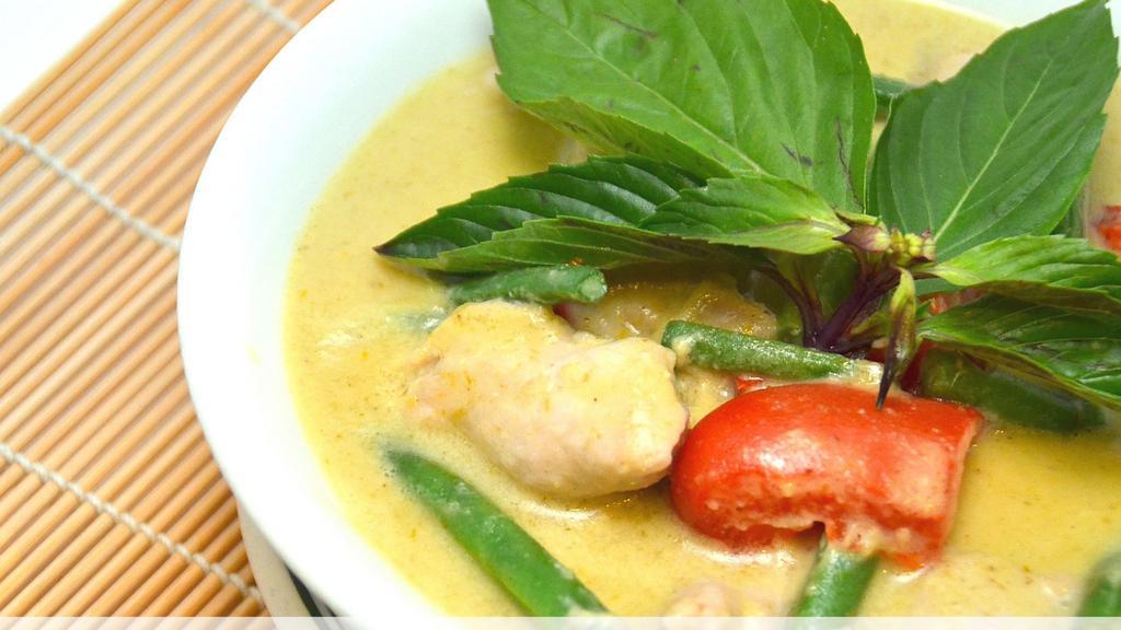 Green Curry · Green curry paste with coconut milk, eggplant, bell pepper, string bean, bamboo shoot, and thai basils.