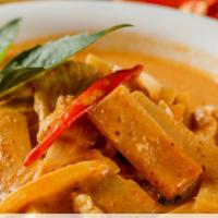 Red Curry · Red curry paste with coconut milk, eggplant, bell pepper, tomato, bamboo shoot, and thai bas...