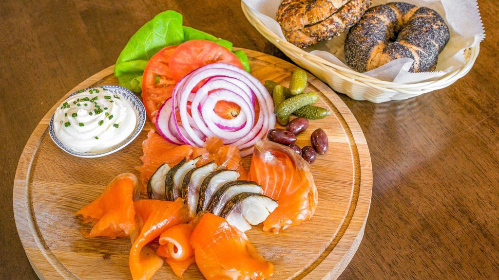 Fish Plate · House-smoked fish curated by our chefs: salmon, arctic char, and torched pickled mackarel, served with a melange of pickles, crudite, cream cheese and two bagels of your choosing.