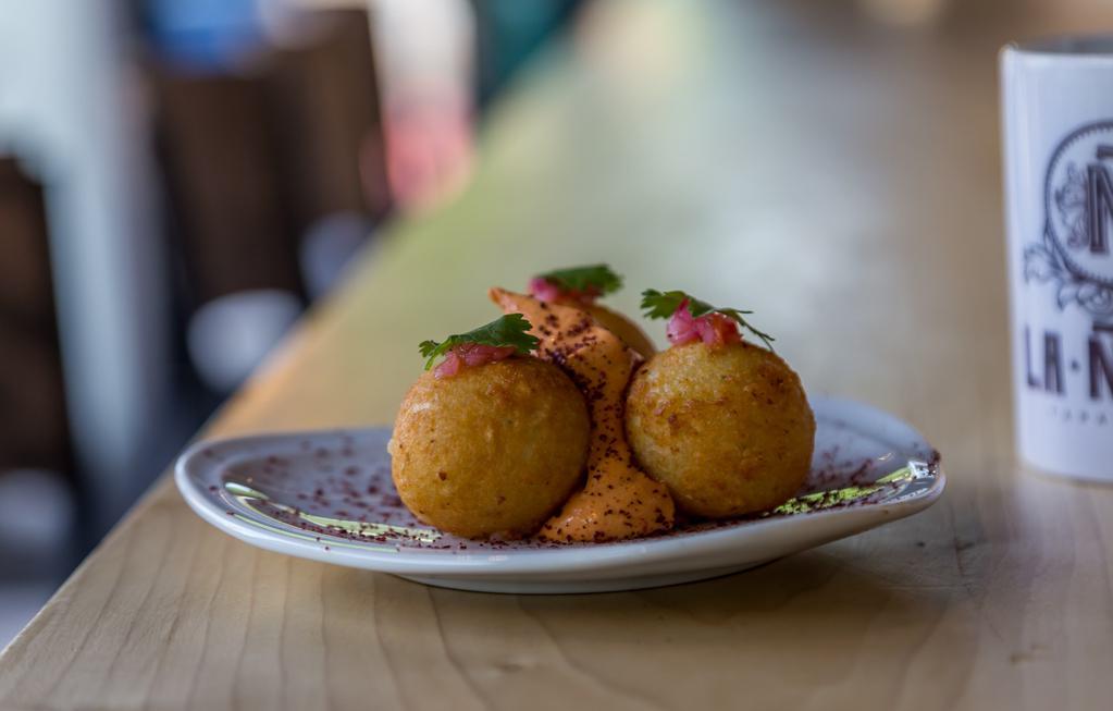 Yuca Balls · Goat and Gouda cheese croquettes, guava cheese.