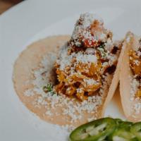 Chicken · Braised chicken with pico and cotija cheese.