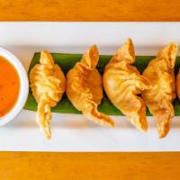 Crispy Crab Wonton · Crispy golden wontons stuffed with shredded imitation crab and cream cheese served with swee...