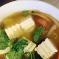 Tom Yum Soup · Iconic South-East Asian soup with a sour and sweet chili-based broth.