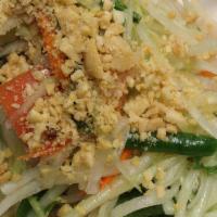 Somtum Papaya Salad · Fresh delicious and healthy Thai specialty tossed and topped with crunchy peanuts.