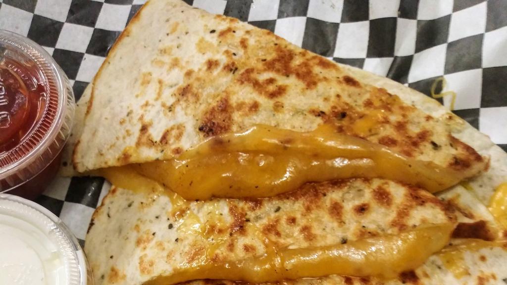Cheese Quesadilla · Cheddar Jack cheese on grilled tortilla , served with a side