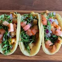 Chicken Tacos · Order of three chicken tacos with cilantro,onions and tomatoes.
