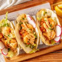Spicy Shrimp Tacos · Spicy sauteed shrimp with pico de gallo, lettuce, radish, and chipotle mayo on three soft co...