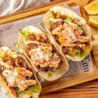 Braised Short-Rib Tacos · 3 Short rib tacos with chipotle mayo, grated cheese, lettuce, and pico de gallo on soft corn...