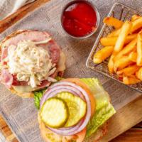 Woodbines Burger · With Irish cheddar cheese, thick Irish bacon, and Irish coleslaw. Made with all-natural, gra...