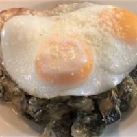 Breakfast Brussels · Caramelized brussel sprouts in a mushroom ragu, 2 sunnyside eggs, and shaved parmesan