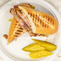 Supper Cubano Sandwich · Grilled roast pork, ham, melted Swiss, pickle and mustard on toasted garlic bread.