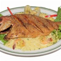 Fried Red Snapper Topped With Seafood Chowder · Rice, French Fries & Salad.