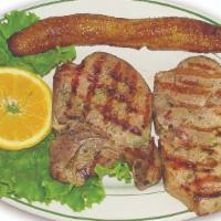 Grilled Pork Chops · Rice, Beans, Sweet Plantain, French Fries, Corn Cake & Salad.