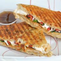Grilled Chicken Panini · Grilled chicken, fresh mozzarella, roasted red peppers, broccoli rabe, on garlic focaccia