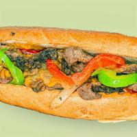 Classic Philly Cheesesteak · Sliced ribeye steak, peppers, onions, house made cheese sauce