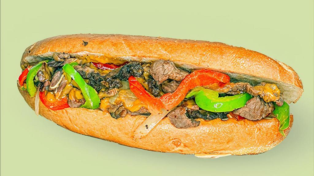 Classic Philly Cheesesteak · Sliced ribeye steak, peppers, onions, house made cheese sauce