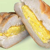 Egg On A Roll · One cage free scrambled egg on a roll.