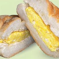 Two Eggs On A Roll · Two cage free scrambled eggs on a roll.