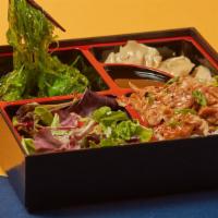 Chicken Bento Box · Served with steamed rice, 3 pieces fried dumplings, seaweed salad and garden salad.