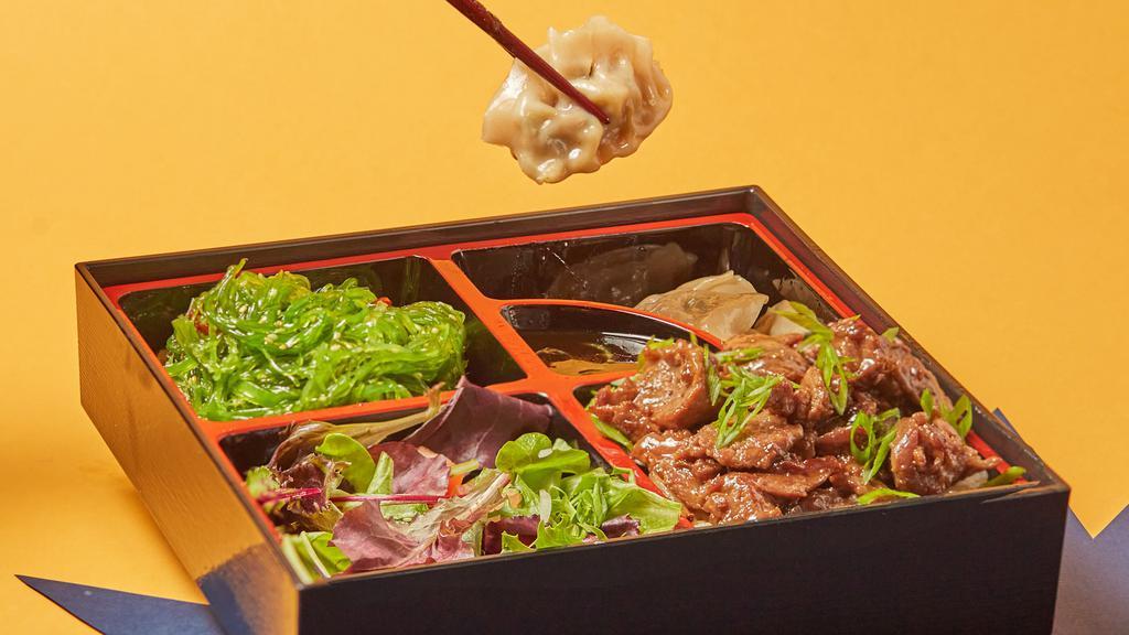 Beef Bento Box · Served with steamed rice, 3 pieces fried dumplings, seaweed salad and garden salad.