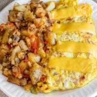 Western Omelet With Cheese · Three farm fresh eggs cooked to order served with potatoes and toast.