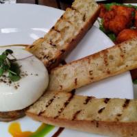 Maplebrook Burrata · Gluten-free. Tomato and kalamata olive tapenade, grilled bread