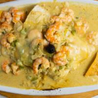 Enchiladas Del Mar · A testy combination of juicy baby shrimp and crabmeat covered with a creamy wine sauce and t...
