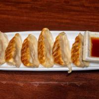 Gyoza · Favorite. Six pan-fried dumplings. Pork or seafood.