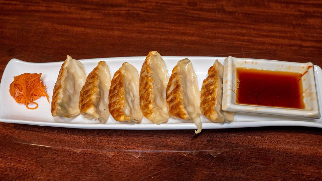 Gyoza · Favorite. Six pan-fried dumplings. Pork or seafood.