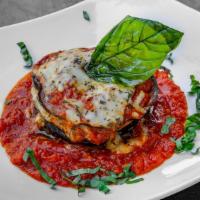 Eggplant Parmigiana Fried · Served with tomato sauce mozzarella with and basil.
