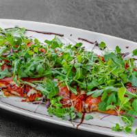 Flatbread Pizza · Served with homemade tomato sauce, mozzarella cheese, fresh basil and arugula.